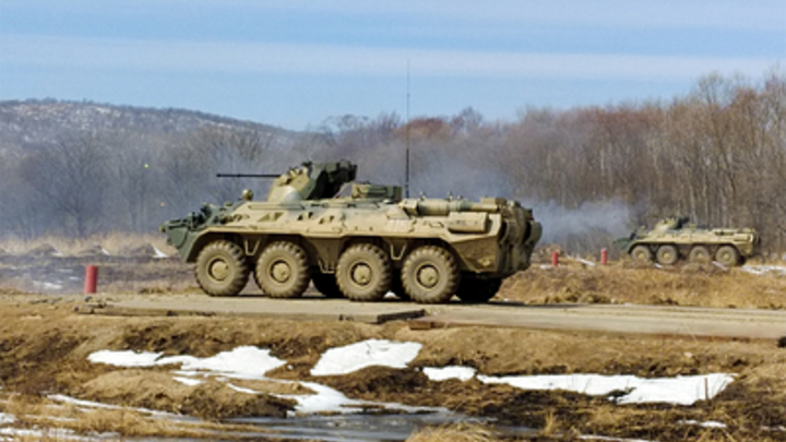 Ракетный удар по российским военным в Сирии попал на видео: БТР уничтожен, трое ранены